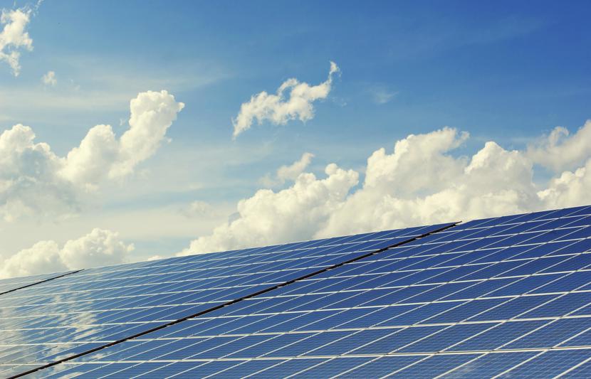 solar farm with blue sky back drop