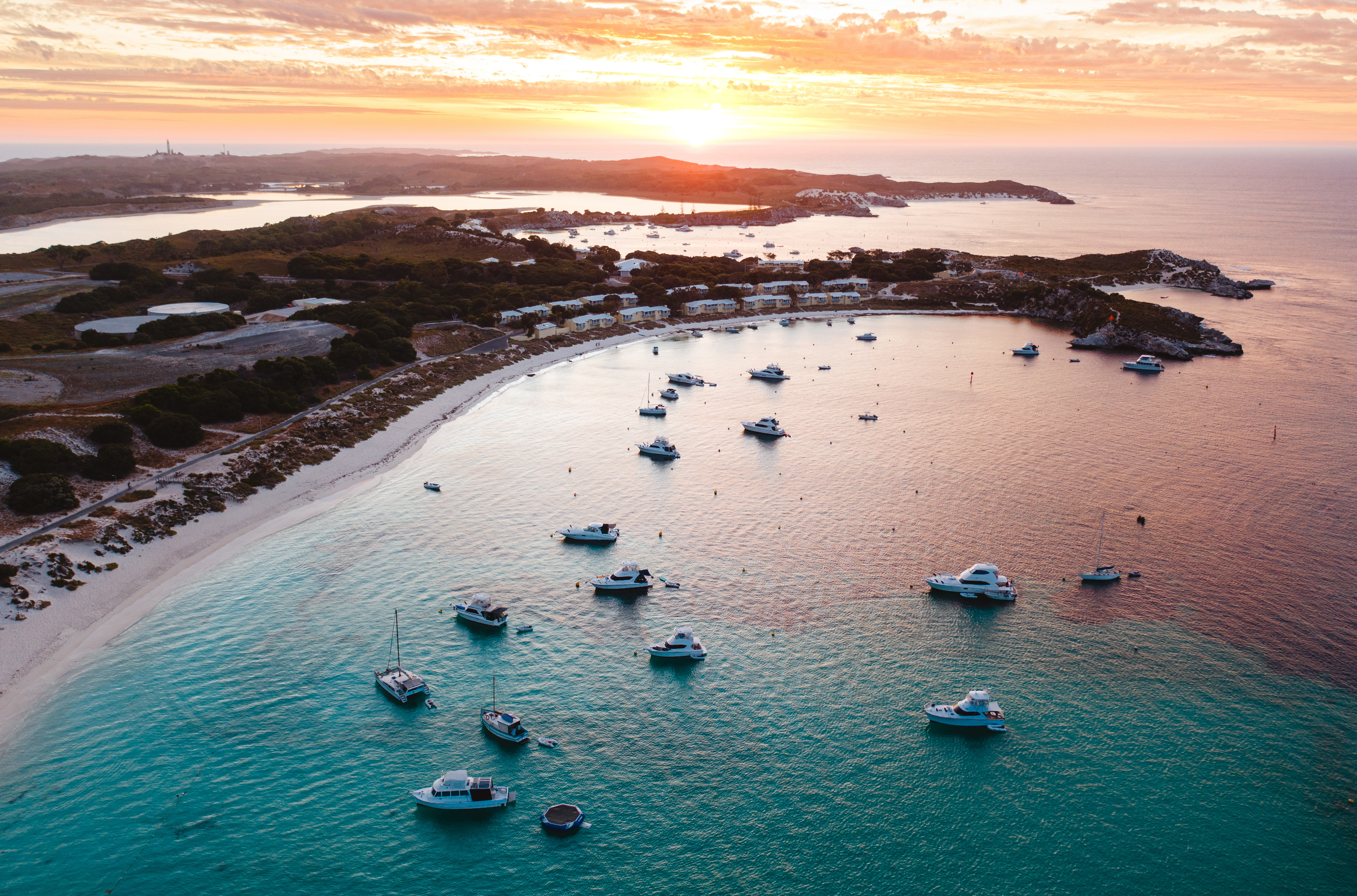Boats moored off the beach at sunset, Rottnest Island, Western Australia