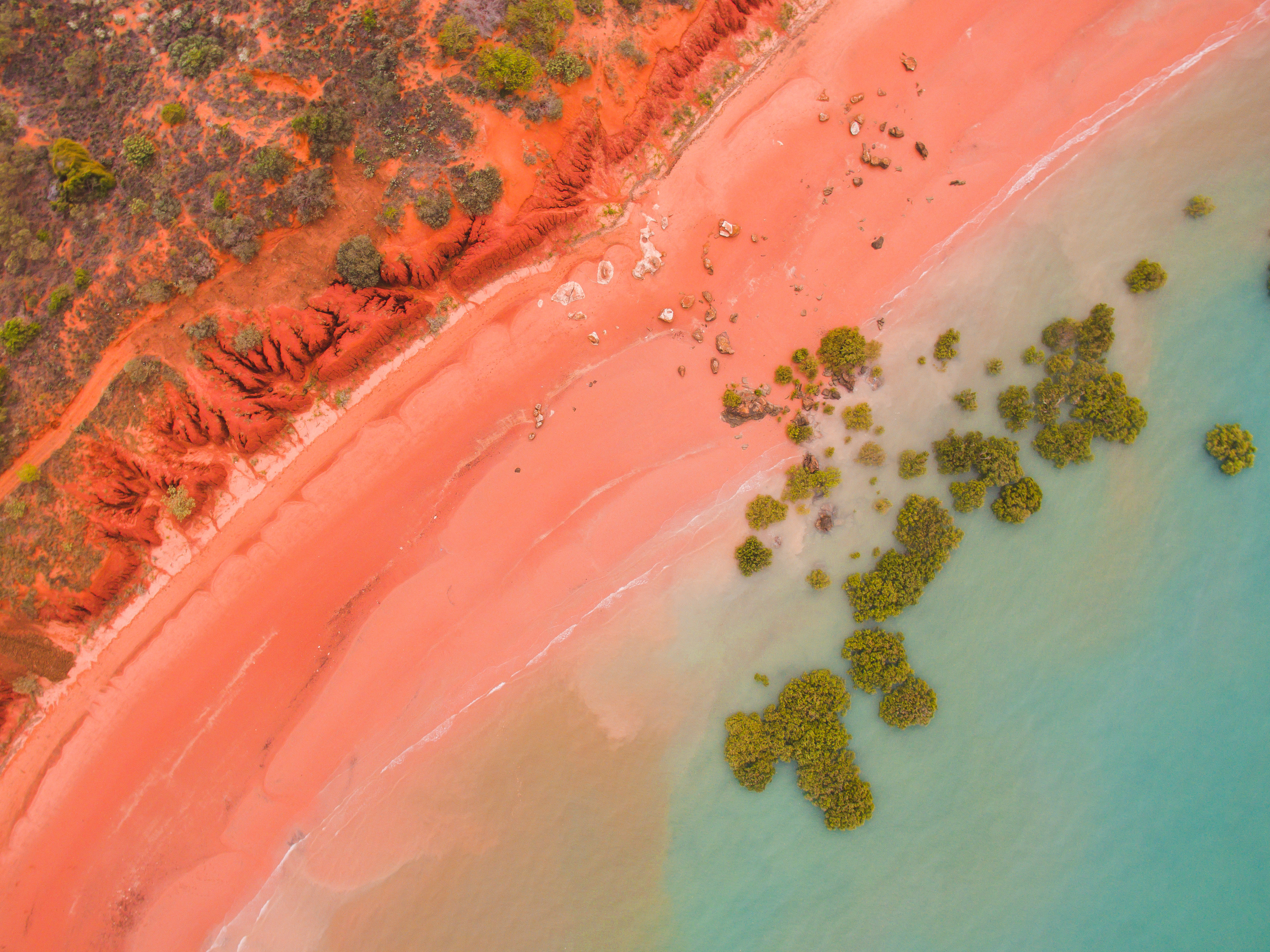Desert meets the sea - an aerial view of ocean and desert sand dune beach, Broome Western Australia