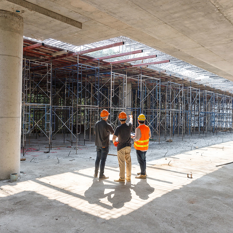 Construction project manager with site workers.jpg