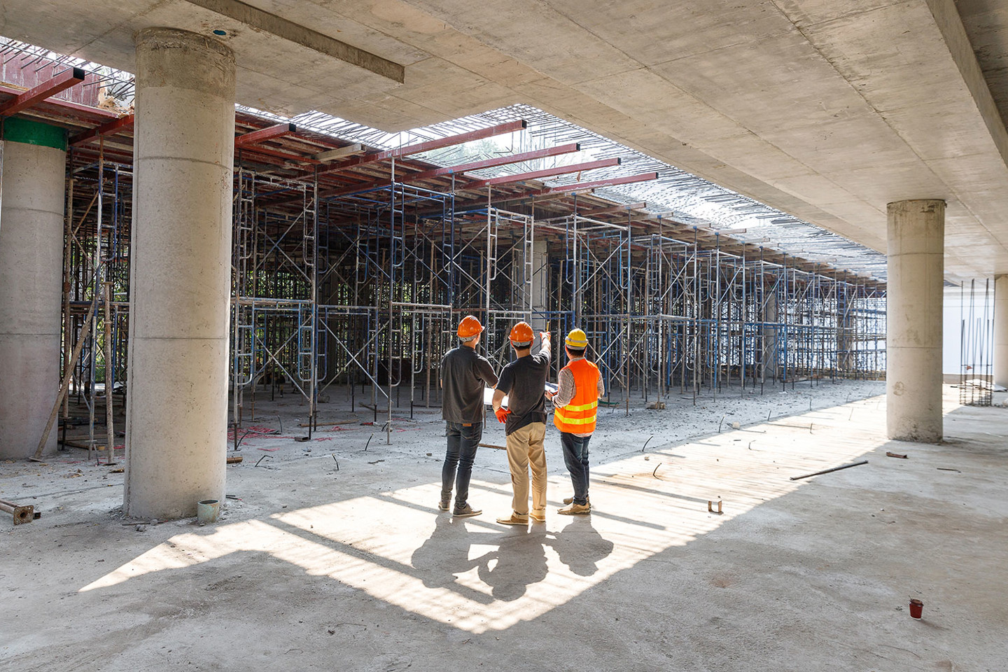 Construction project manager with site workers.jpg