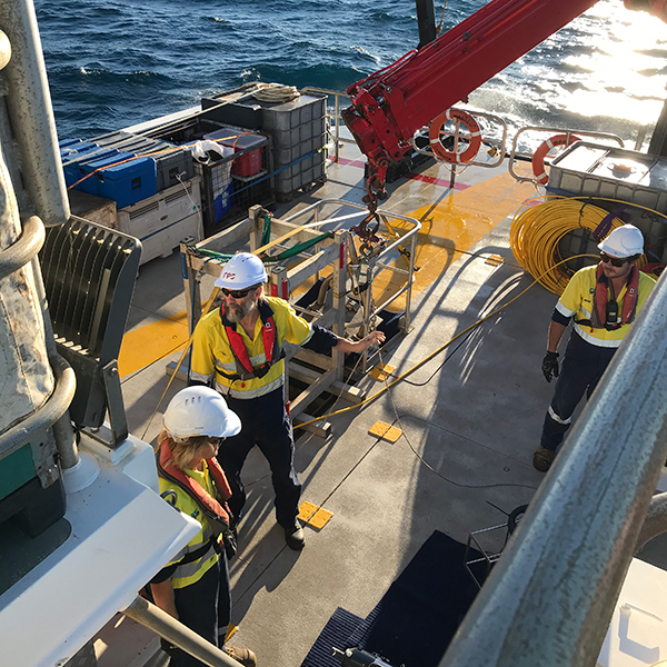 RPS personnel and crew managing operations on deck while completing offshore marine surveys for Santos in Western Australia.