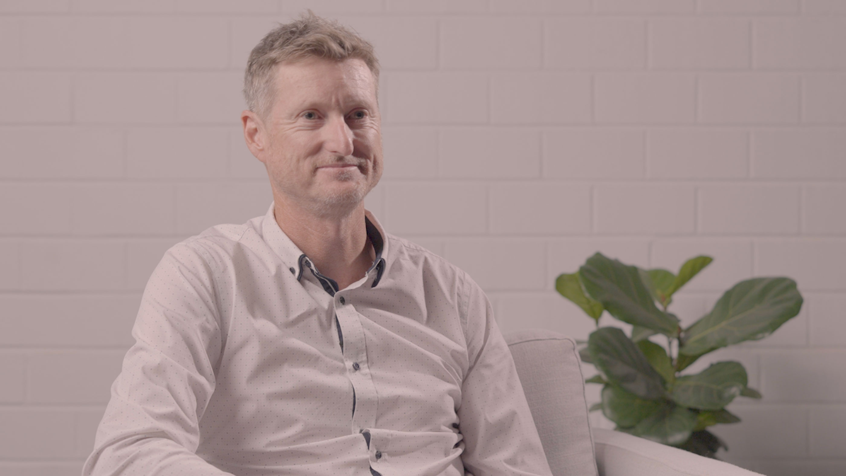 RPS’ Executive Director – MetOcean Science and Technology, Murray Burling sits on an armchair and smiles looking ahead with a pot plant behind him.  