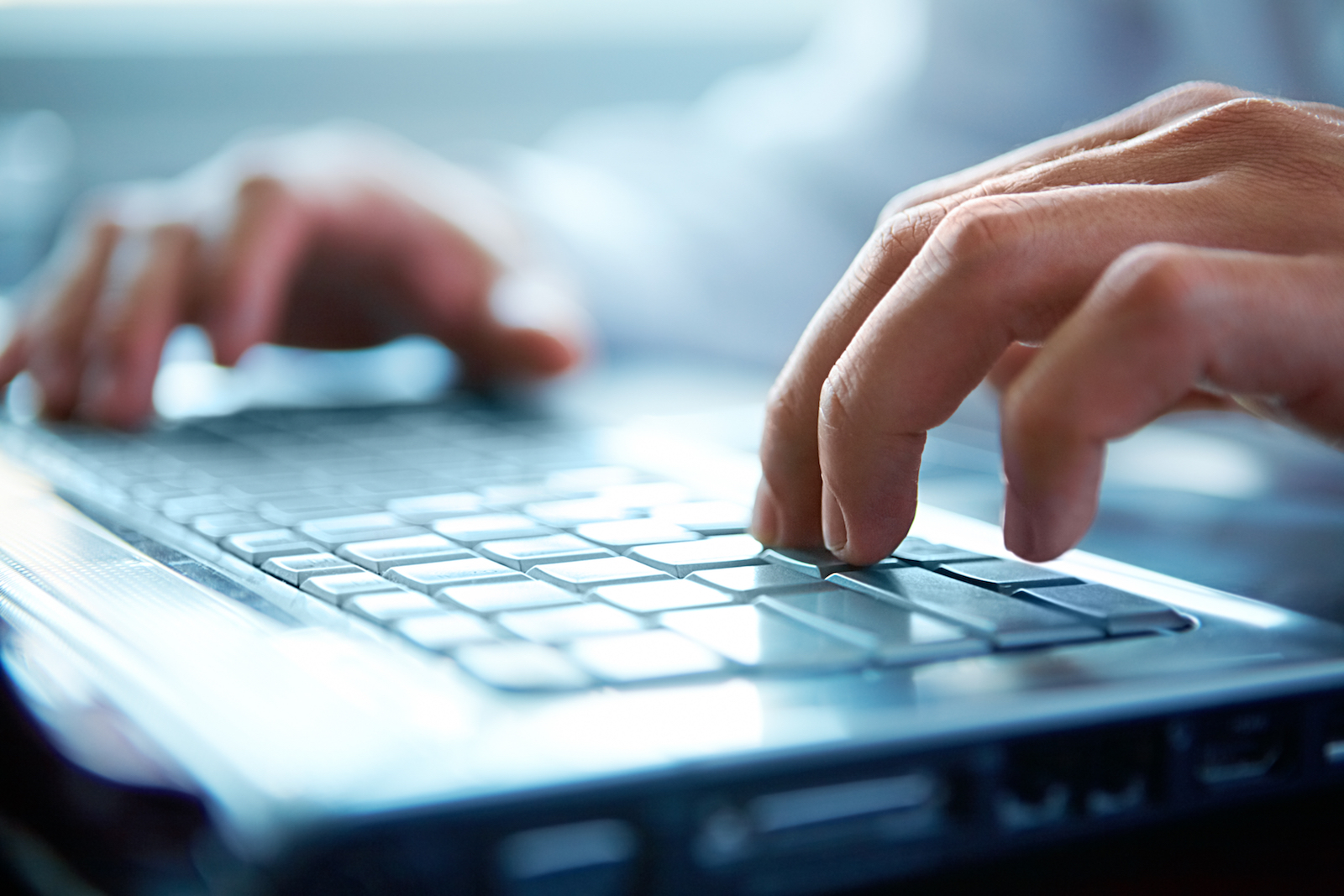 RPS consultants hands on laptop while applying RPS Information and Telecommunications (ICT) solutions