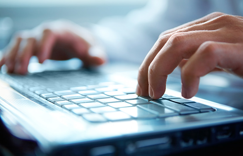 RPS consultants hands on laptop while applying RPS Information and Telecommunications (ICT) solutions