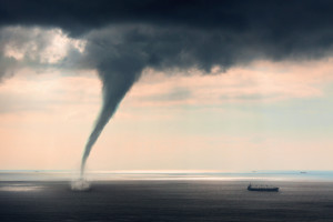 A tornado out at sea with ship