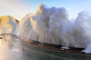 Wave crashing against harbour wall in San Sebastian Donostia, Spain