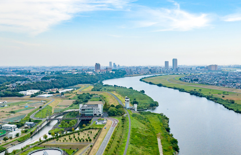 A river leading to a city view in the background