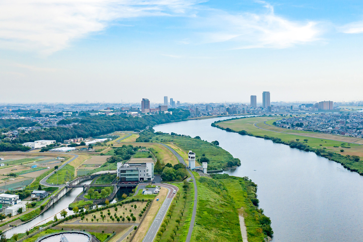 A river leading to a city view in the background