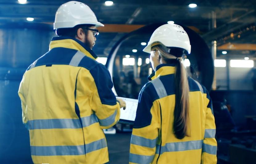 Two people conducting a health and safety assessment.