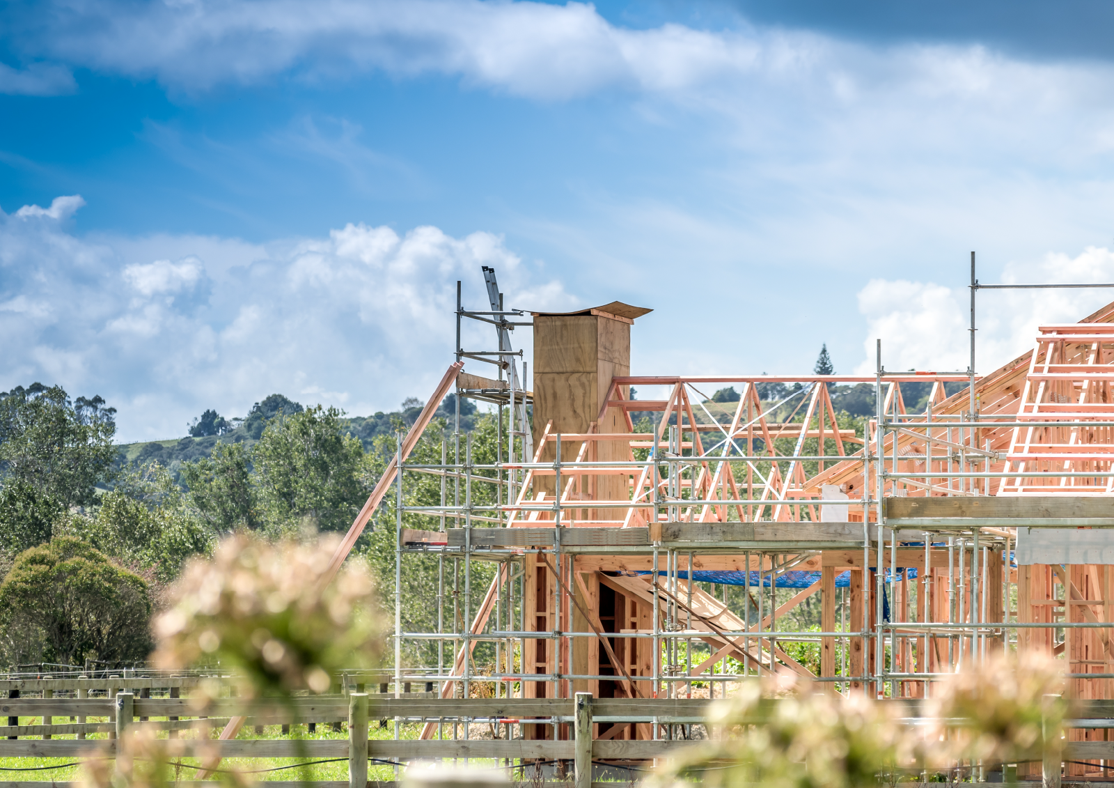 New build house in construction surrounded by green space