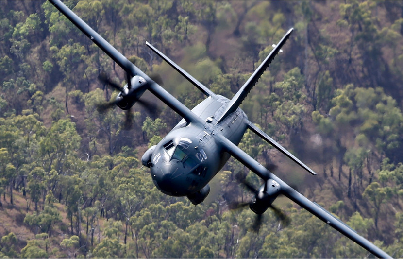Royal Australian Air Force C-27J Spartan Battlefield Airlifters fleet in flight over bush