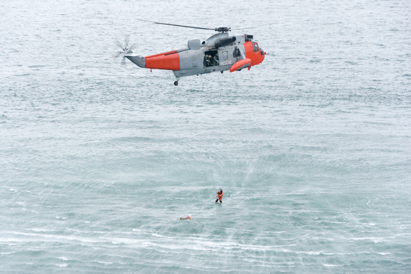 Helicopter with person over the ocean