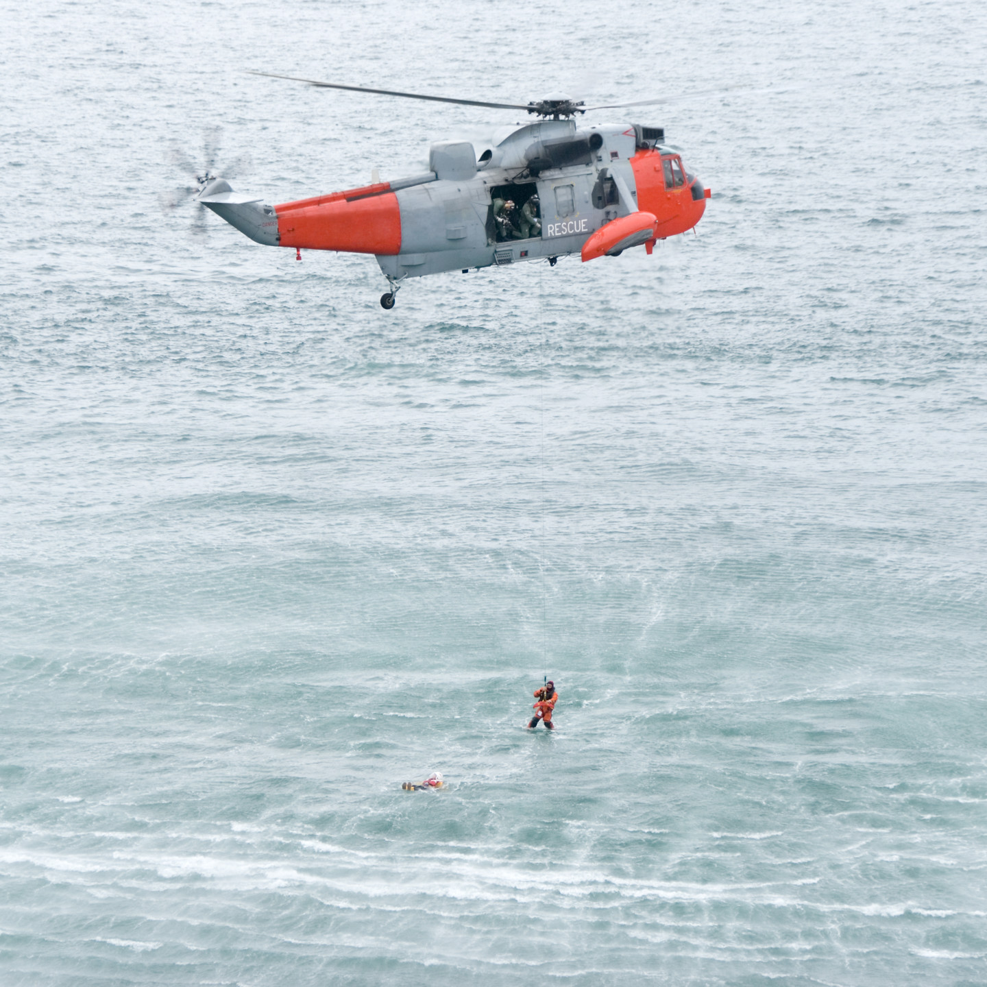 Helicopter with person over the ocean