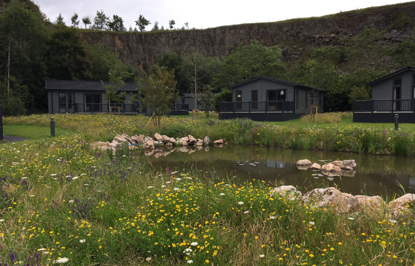 View of the redeveloped Rivendale Holiday Park with grasslands and ponds