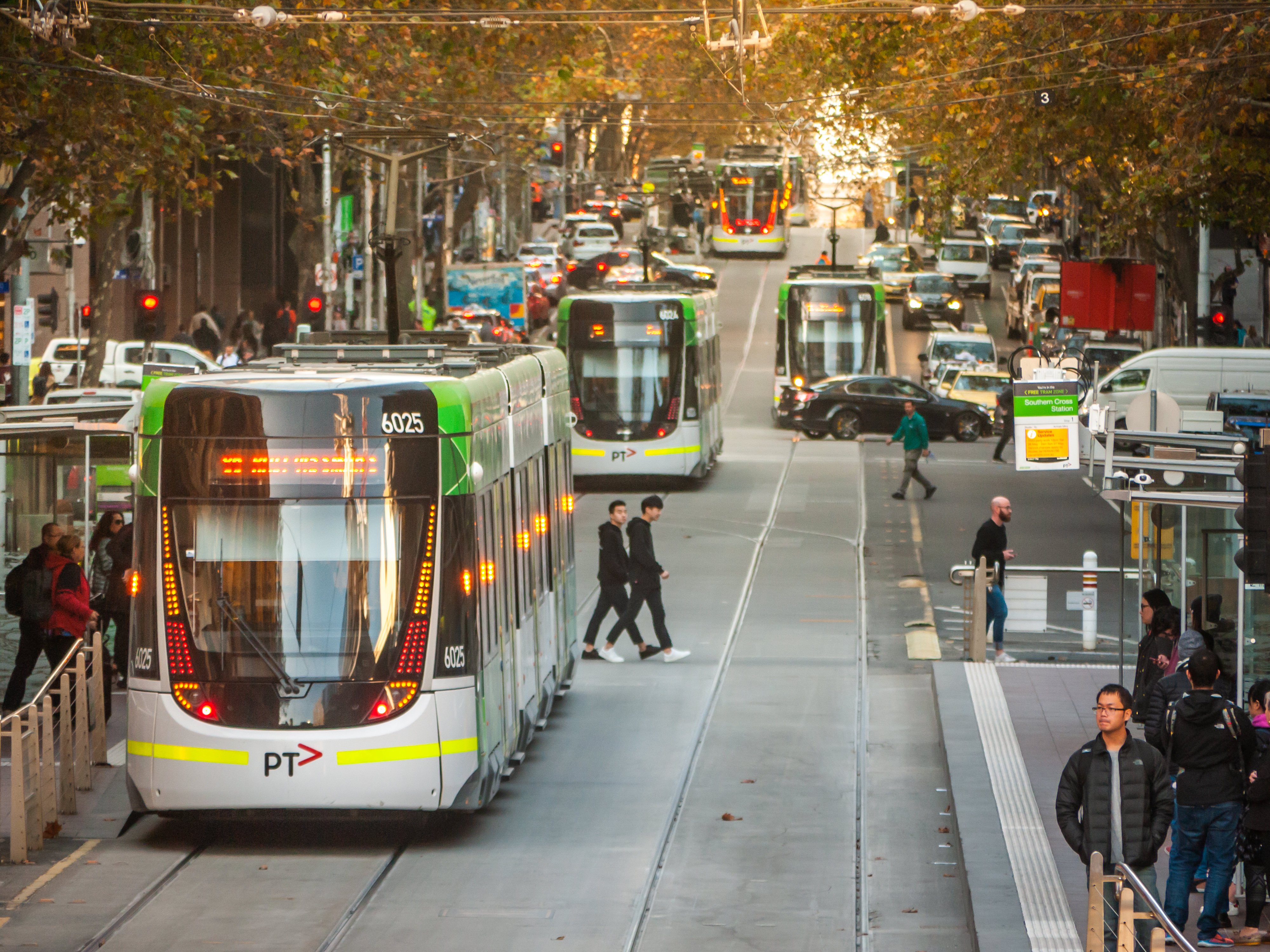 Melbourne trams in busy Melbourne city street
