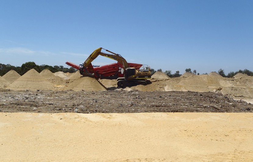 Excavator working on sunny day
