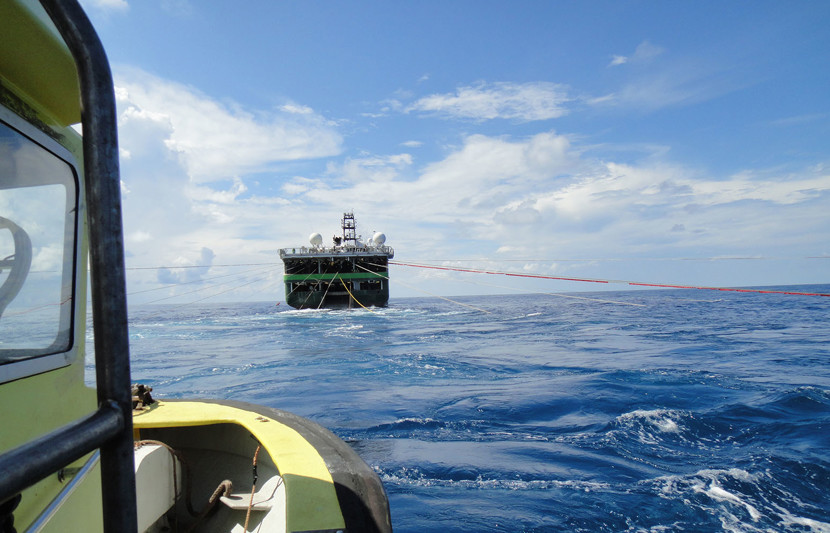 Seismic vessel with streamers taken from support boat on Apache survey