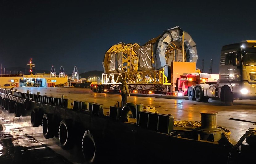 Image of a LiDAR being transported at night on a large truck
