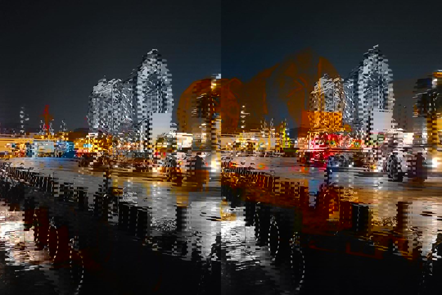 Image of a LiDAR being transported at night on a large truck