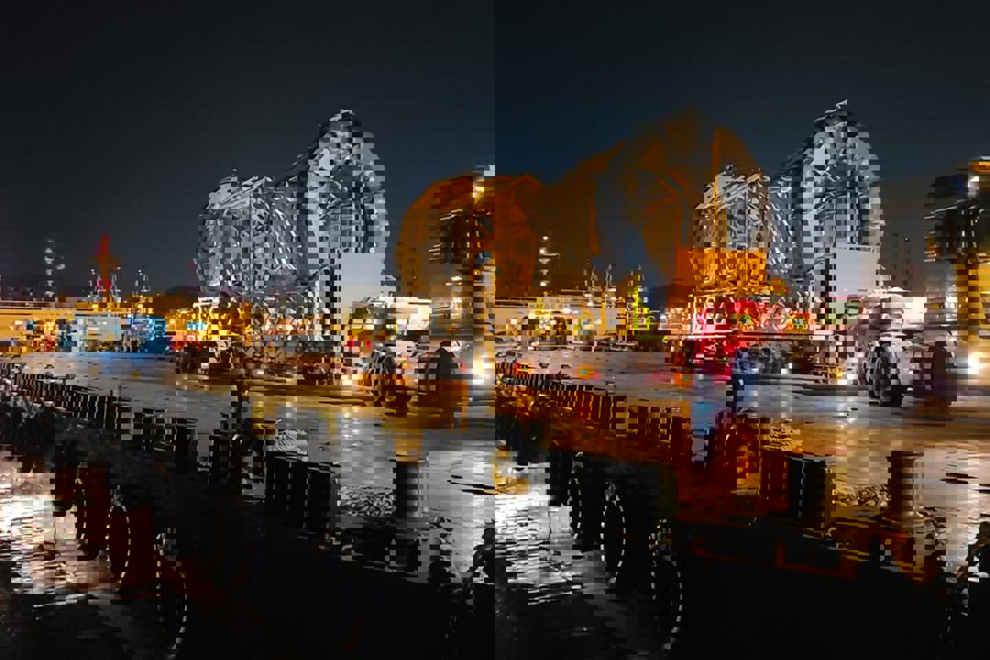 Image of a LiDAR being transported at night on a large truck