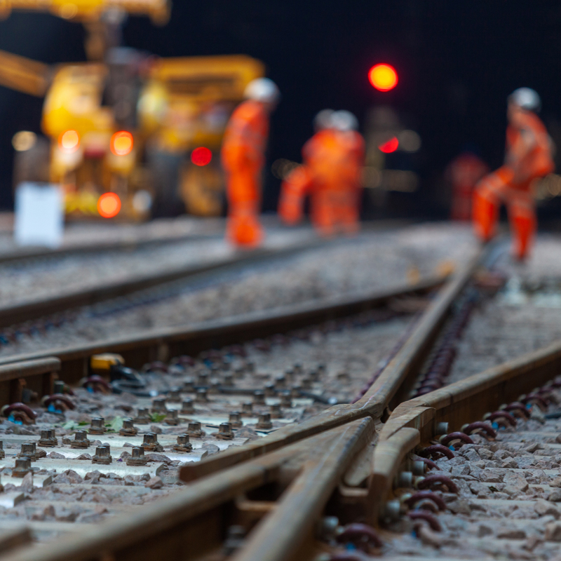 Workers at rail construction site