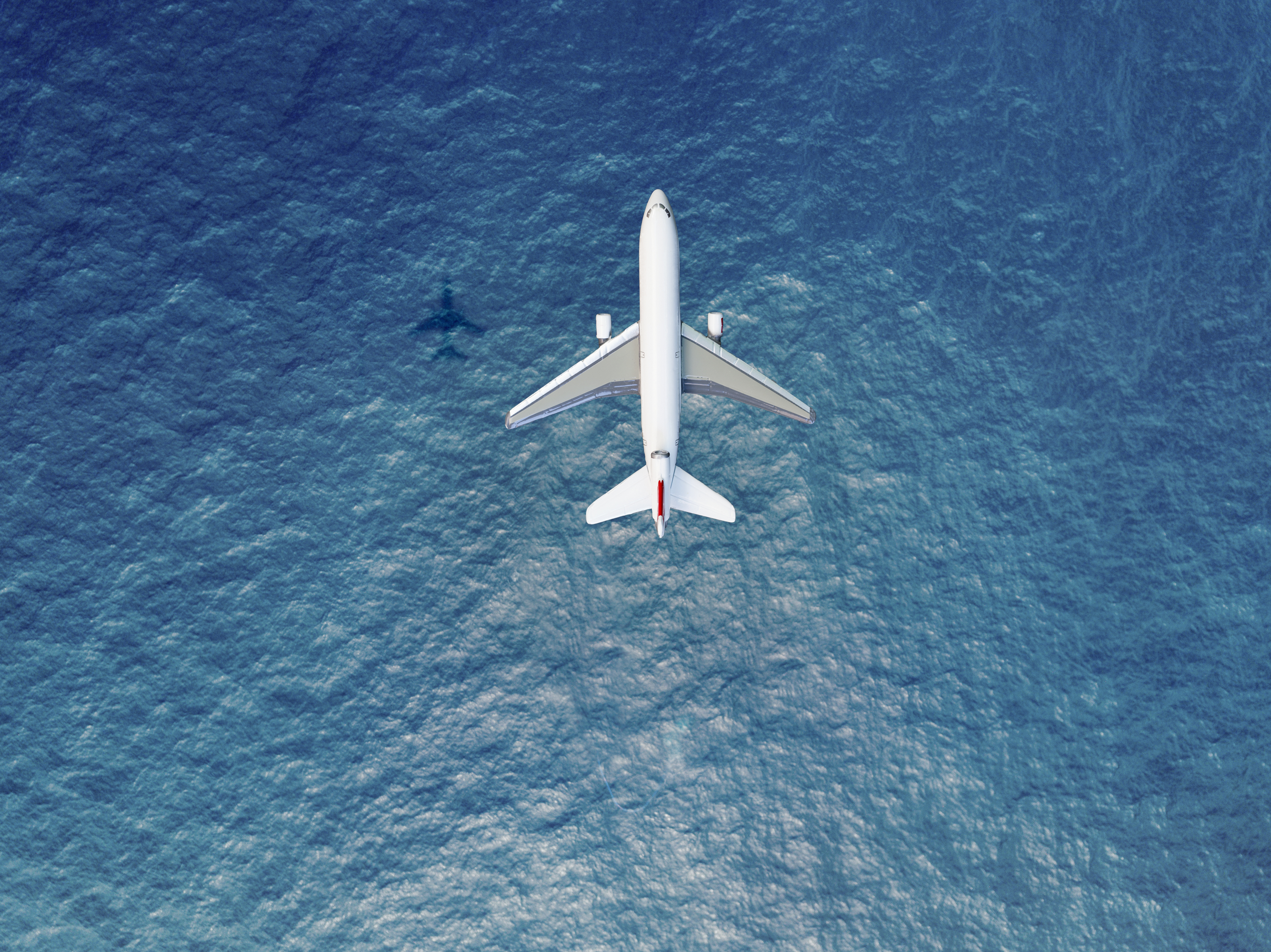 Plane flying over water