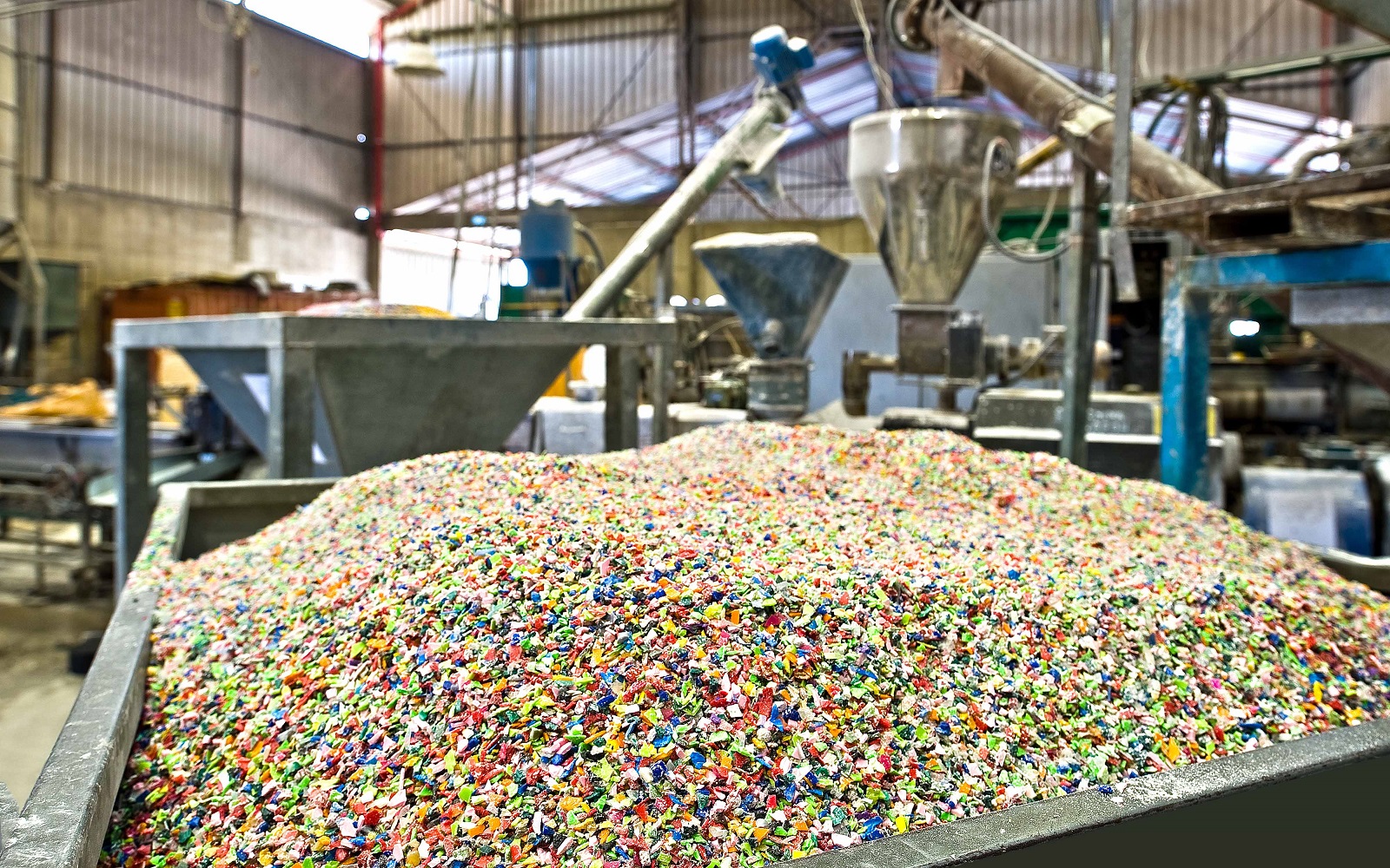 Shredded plastic components in reprocessing facility