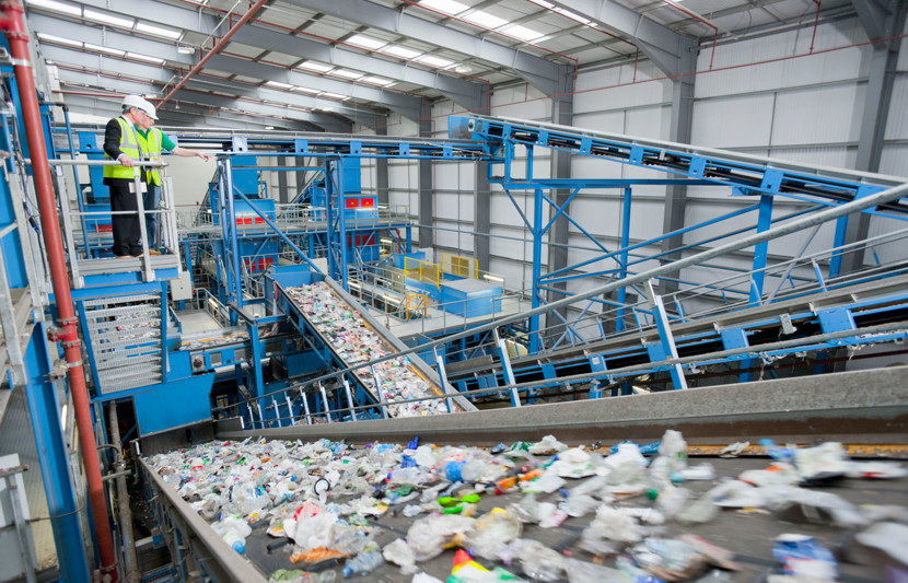 Recycling plant with plastic bottles on a conveyor belt