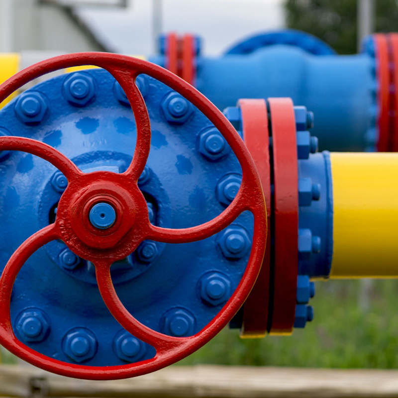 gas pipeline with yellow pipes and red valve for underground gas storage