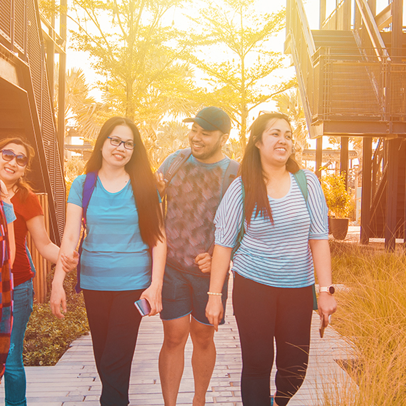 Family walking through residential area.