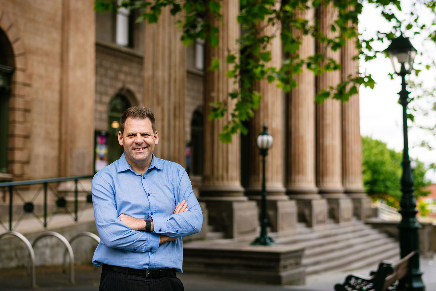 Scott Richardson, RPS Senior Systems Engineer is standing in front of the The Capital performing arts theater in Bendigo, Victoria.