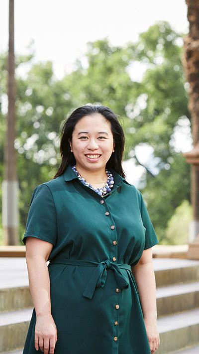 Georgina Leahy, RPS Associate Director is standing outside on the steps of The Old Treasury Building in Melbourne CBD.