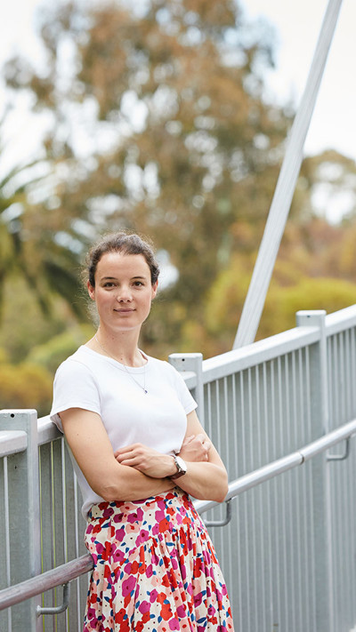 Anna Milder, RPS Senior Consultant - Environment stands on the Afton Street Pedestrian Bridge over the Maribyrnong River in Melbourne.