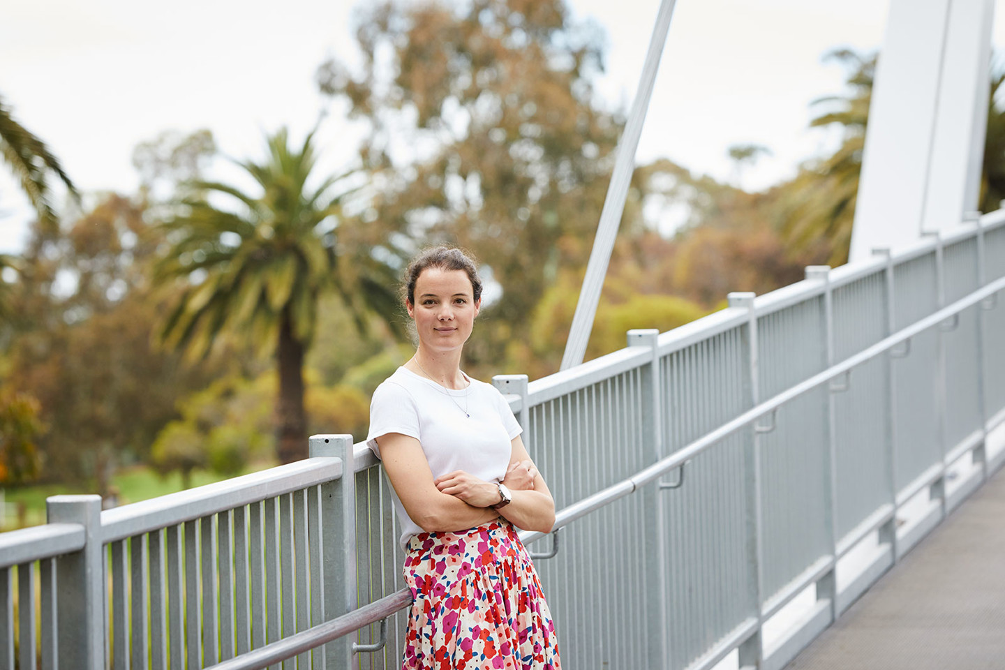 Anna Milder, RPS Senior Consultant - Environment stands on the Afton Street Pedestrian Bridge over the Maribyrnong River in Melbourne.