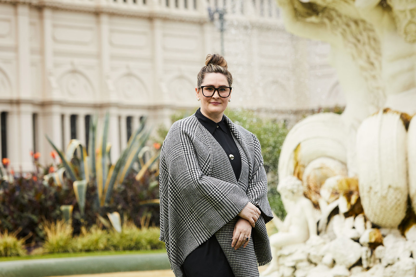 Emma Tranchina, RPS Director of Communications and Engagement stands in front of water fountain in Carlton Gardens in Melbourne CBD.