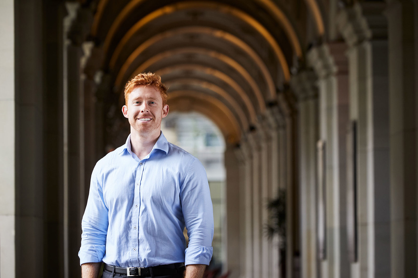 Samuel King, RPS Project Manager stands outside the archways of the old General Post Office in Melbourne CBD.