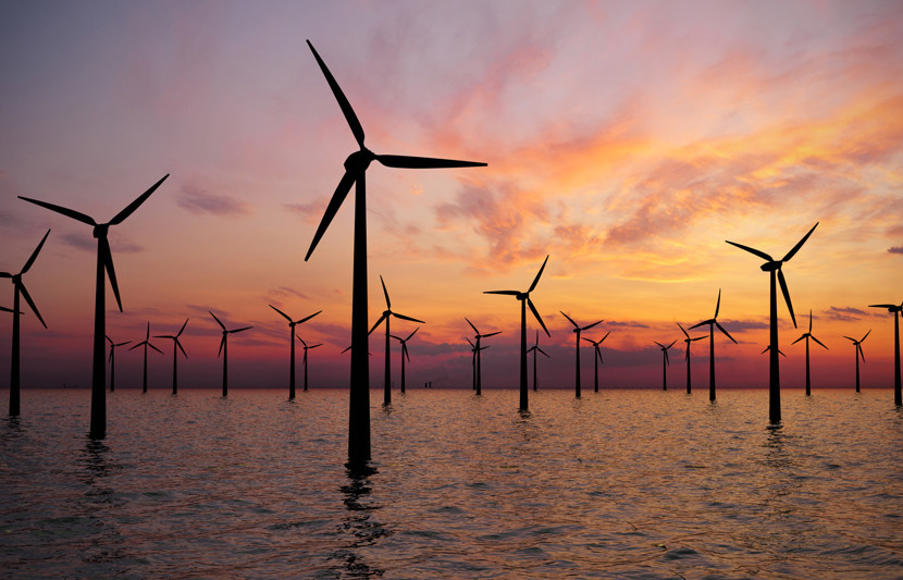 Offshore wind farm installation at sunset