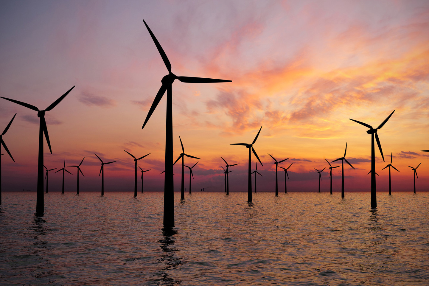 Offshore wind farm installation at sunset