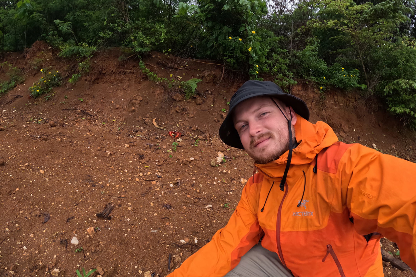 RPS scientist Ciaran Carolan gets up close with a red crab on Christmas Island, during their yearly migration 