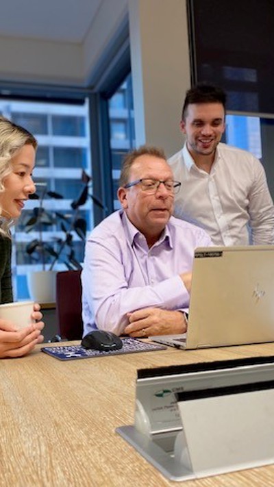 Four commercial advisory team members have an online meeting in boardroom