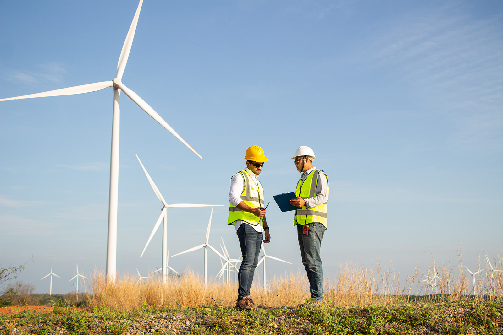 Energy Workers On Site At Wind Farm Installation