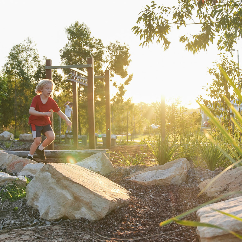 Boy plays in Yarrabilba - Borrol Lookout Park
